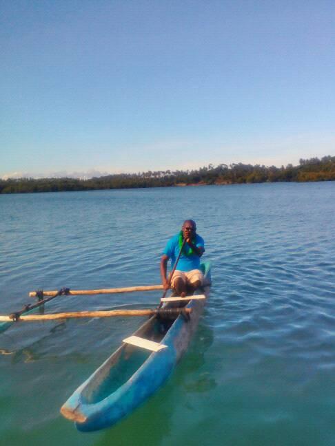 Outrigger boat Catamaran carved out of tree trunk